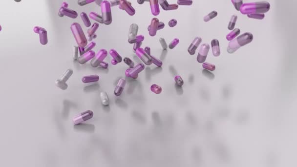 Pillen drugs capsules vallen op witte tabel counter top slowmotion close-up 4k — Stockvideo