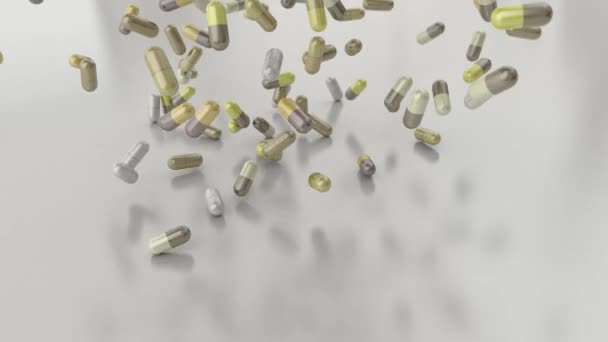 Pills drugs capsules falling on white table counter top slow motion closeup 4K — Stock Video