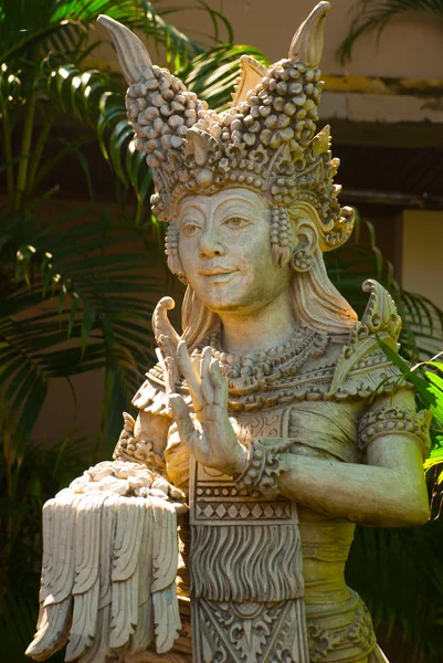 Beautiful female sculpture made of stone. Bali, Indonesia.