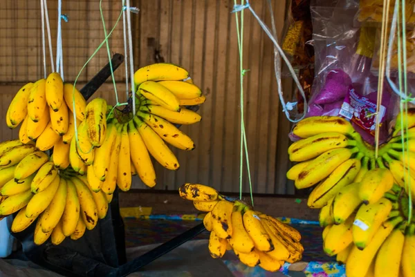 The traditional Asian market with food Malaysia. Bananas on a rope — Stock Photo, Image