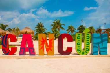 Cancun, Mexico, inscription in front of the Playa Delfines beach. Huge letters of the city name. clipart