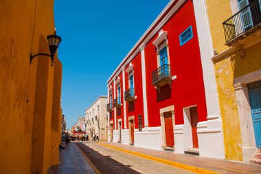 Colonial architecture in San Francisco de Campeche, Mexico. Street with colorful facades of houses. clipart