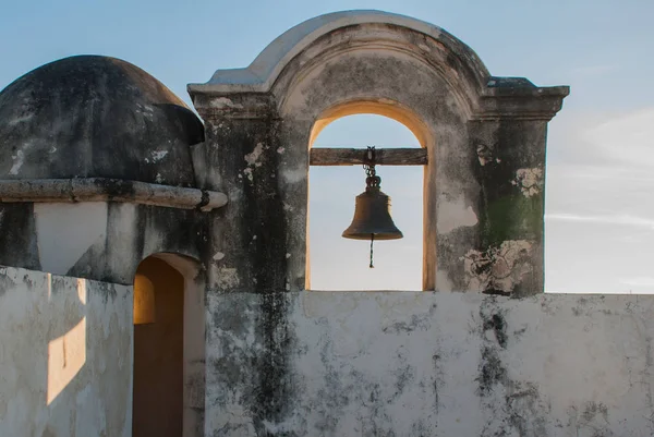 The bell on the guard tower in San Francisco de Campeche, Mexico. View from the fortress walls