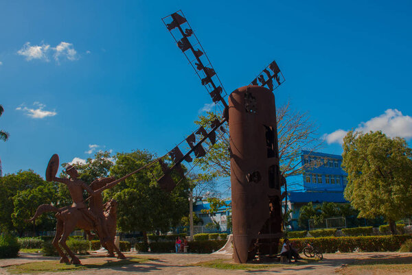 Monument Holguin, Cuba: statue of don Quixote on horse, Sancho Panza and mill