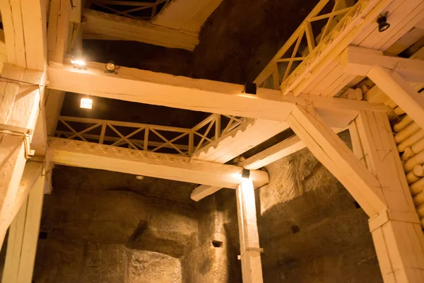 WIELICZKA, POLAND: Construction located underground in Wieliczka Salt MIne Museum in Poland. Wood giant construction makes an impression on tourists.