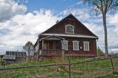 TVER REGION, RUSSIA - MAY 9, 2014: view of an old wooden house in the village