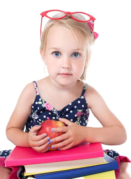 Girl - a student holding an apple Stock Picture