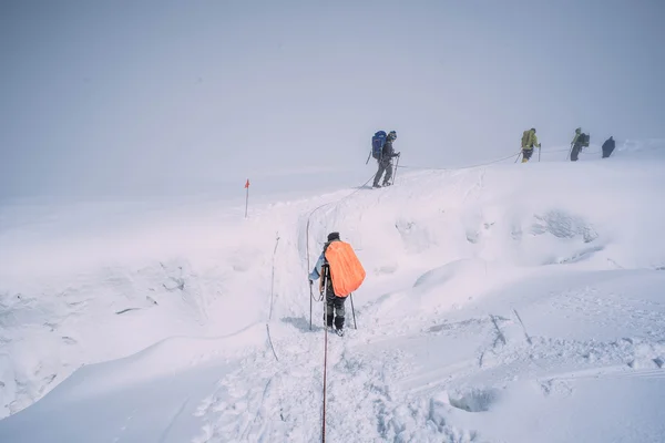 people climbing in mountains