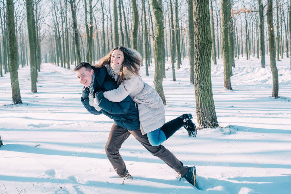 couple having fun in snowy park