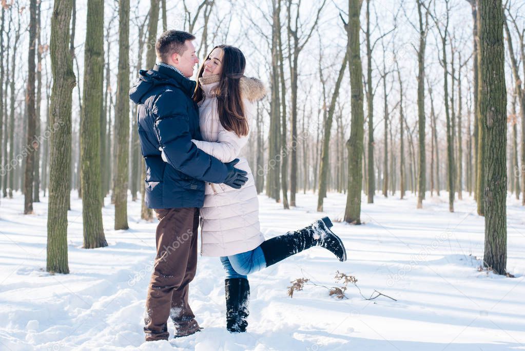 couple having fun in snowy park