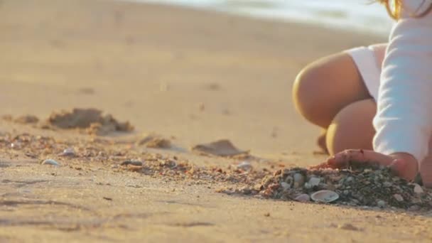 Carefree Unrecognizable Girl Places Seashells Drawn Heart Shape Wet Sand — Stock Video