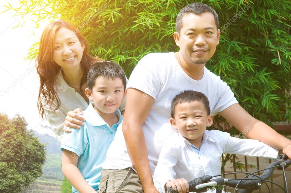 Outdoor portrait of asian family