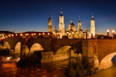 Cathedral of Our Lady of Pilar and  the Stone bridge clipart