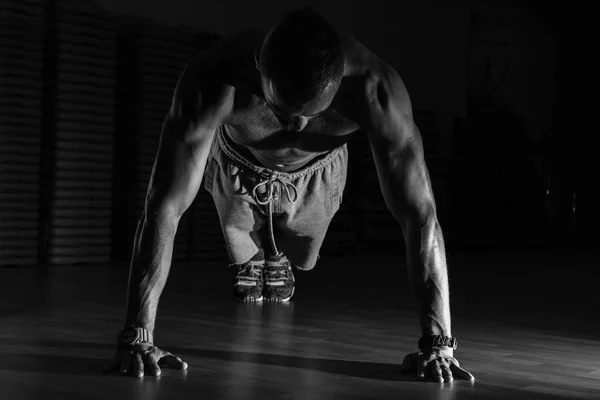 Fitness model exercising sit ups and crunches. Muscular well bui