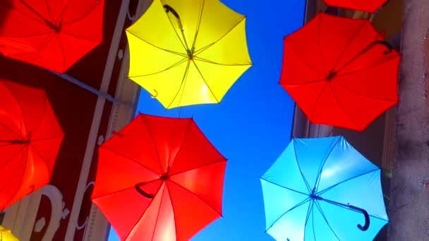 Opened Colorful Bold Colored Umbrellas Hanging Wires Street — Stok video