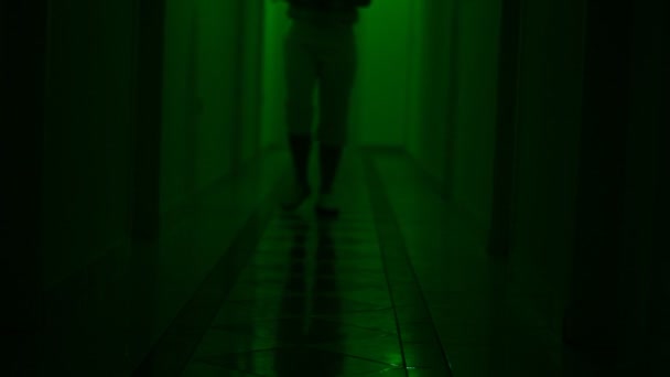 Unknown Blurred People Walking Dark Hallway Searching Something — Vídeo de stock