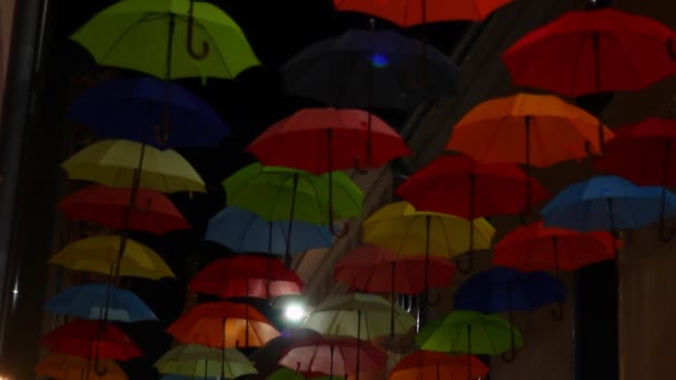 Opened Colorful Bold Colored Umbrellas Hanging Wires Street — Stockvideo