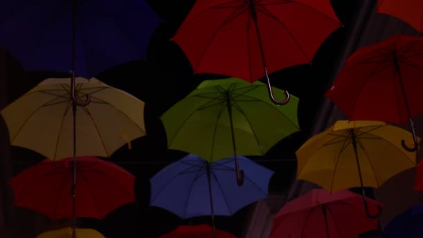 Opened Colorful Bold Colored Umbrellas Hanging Wires Street — ストック動画