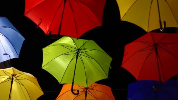 Opened Colorful Bold Colored Umbrellas Hanging Wires Street — Stockvideo