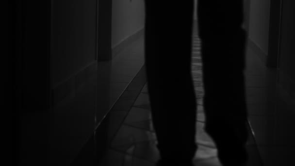 Unknown Blurred People Walking Dark Hallway Searching Something — Stock video