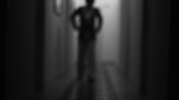 Unknown Blurred People Walking Dark Hallway Searching Something — 图库视频影像