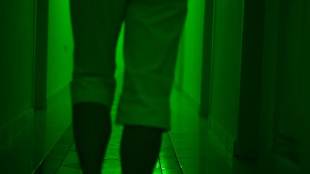 Unknown Blurred People Walking Dark Hallway Searching Something — Stockvideo