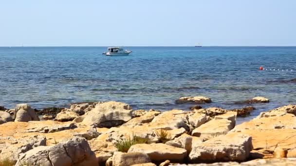 Small Motor Boat Approaching Buoy Markers Dividing Swimming Safe Area — Stockvideo