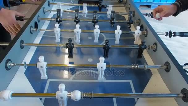 Active people playing foosball. table soccer plaers. Friends play together table football — Stock Video