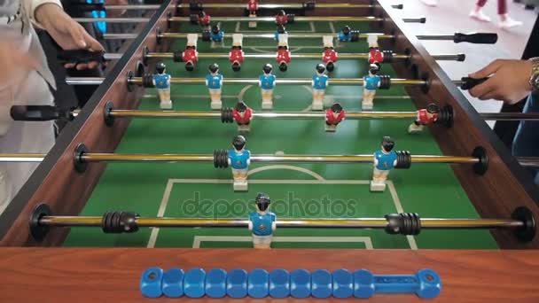 Active people playing foosball. table soccer plaers. Friends play together table football — Stock Video