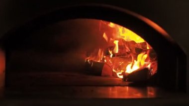 Burning Firewood In The Fireplace Closeup Glowing Logs Fire And