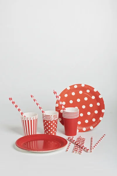 Red disposable tableware for parties and picnics.