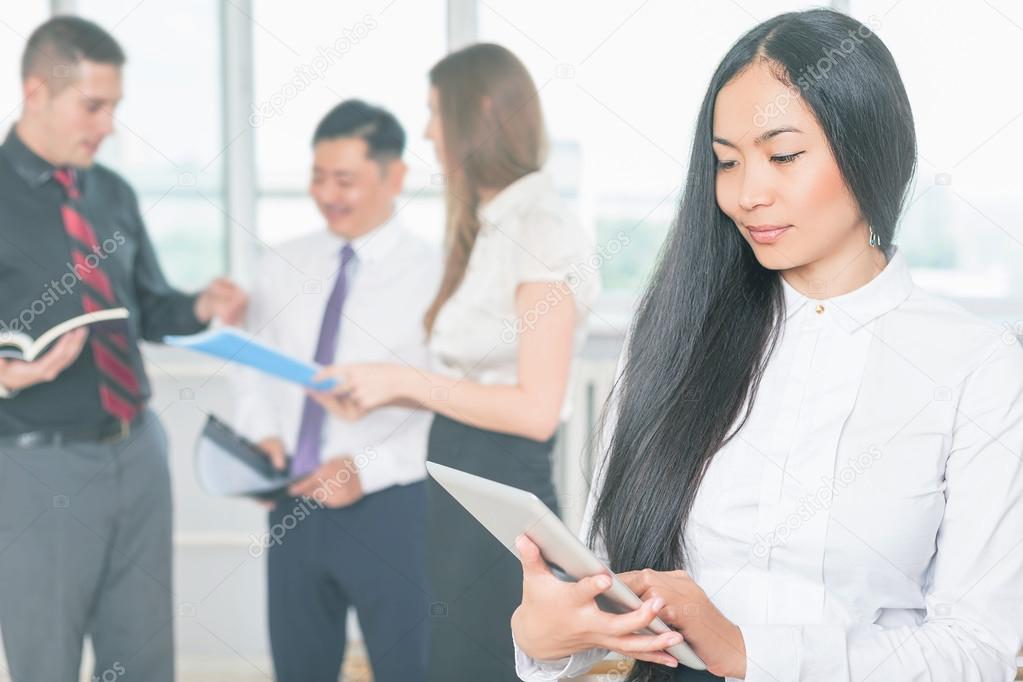 Asian business woman using tablet PC. Online banking