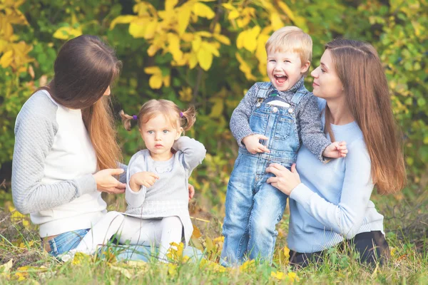 Alternative lesbian family with mothers, daughter and boy outdoor — Φωτογραφία Αρχείου