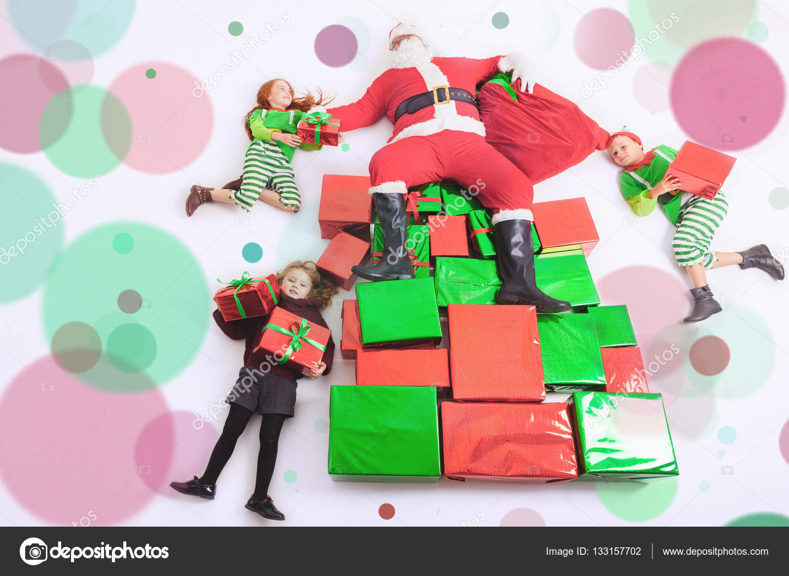 Santas helpers working at North Pole. He reading wishes list Stock