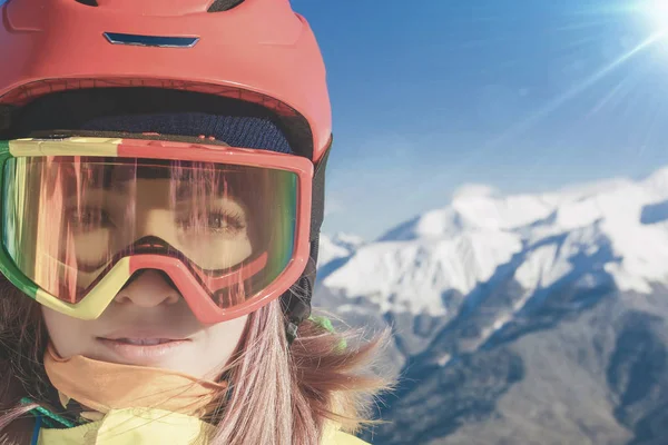 Snowboarder girl at Alps, Swiss mountain. Winter activities