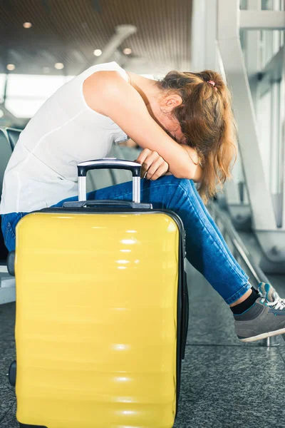 Woman carries your luggage at the airport terminal Stock Photo