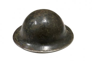 Genuine World War One helmet isolated on a white background side view clipart