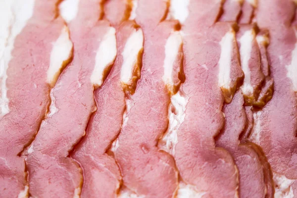 Primo piano, sfondo di pancetta cruda — Foto Stock