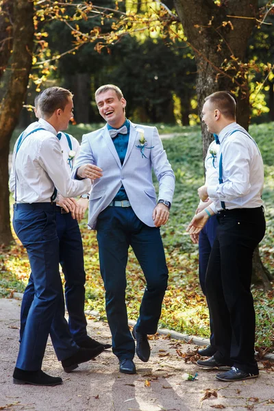Fiance having fun with groomsmen in the park — Stock Photo, Image