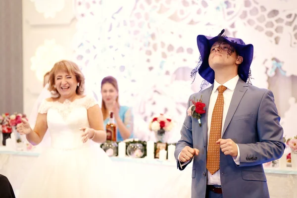 Happy beautiful newlyweds in restaurant — Stock Photo, Image