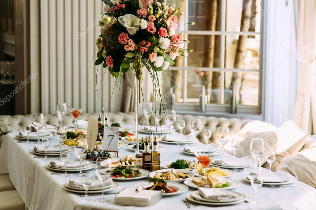 Table with food and flowers on the wedding