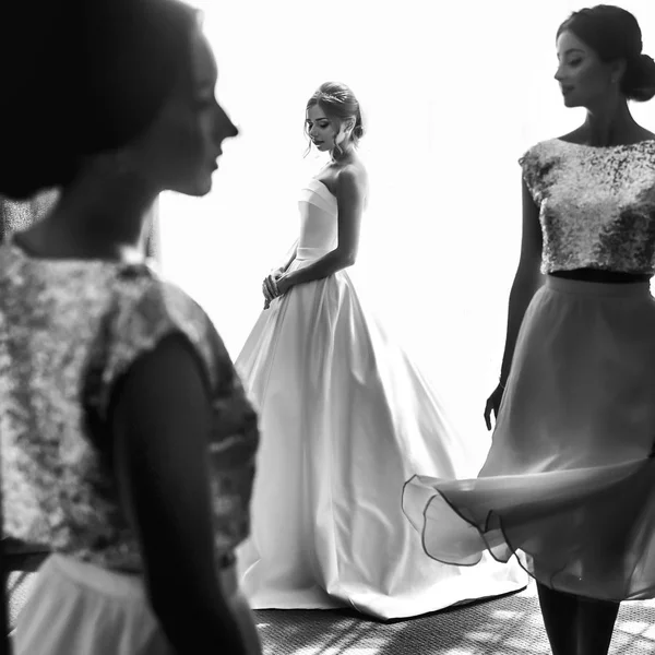 Bride and friends wait for the wedding ceremony