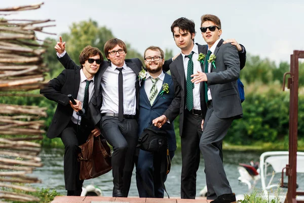 Stylish guys and groom in black suit look ready for a party — Stock Photo, Image