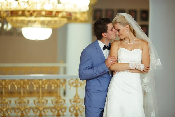 Groom is kissing his beautiful bride — Stock Photo, Image