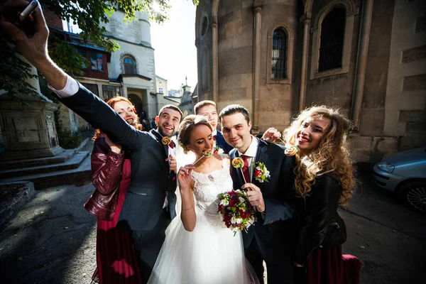 The brides with friends eatting sweets