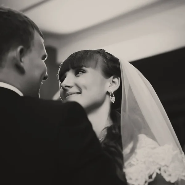 Adorable bride looks at a groom with love — Stock Photo, Image