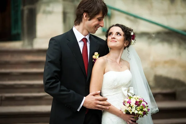 Fiance holds bride's elbow tender looking at her with love — Stock Photo, Image