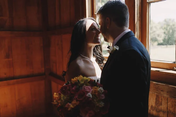 A moment before a kiss between loving newlyweds standing in the — Stock Photo, Image