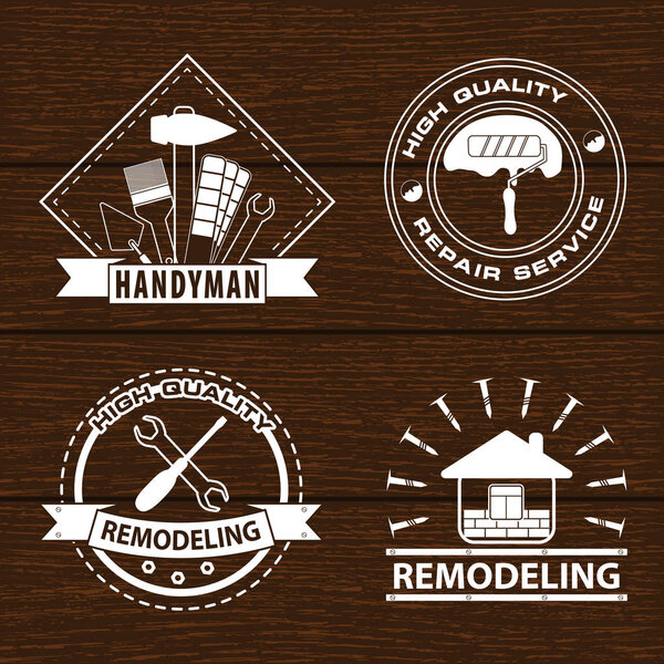 Set of house renovation labels and home remodeling logos. Handyman logo on wooden background. Stock vector. Flat design. 