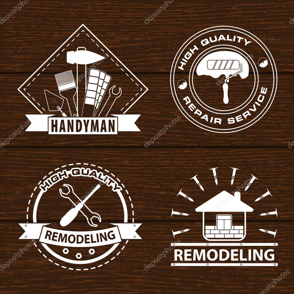 Set of house renovation labels and home remodeling logos. Handyman logo on wooden background. Stock vector. Flat design.